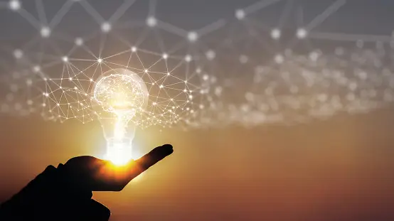 Light bulb in the palm of a hand