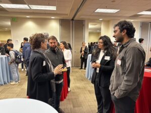 Students and researchers chat during a break at C&C.