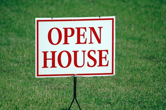 photo of a sign that reads "Open House"