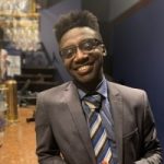 Headshot of Justin Adjasu